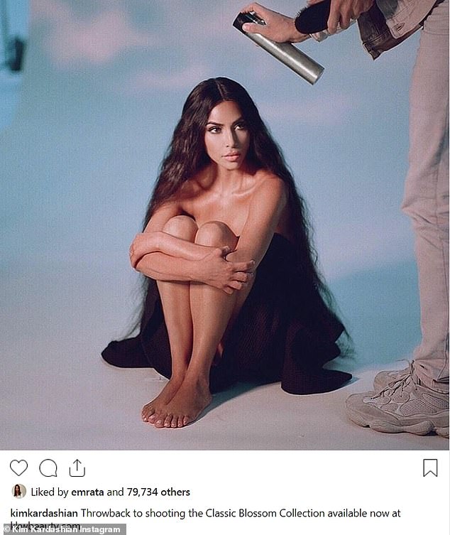 Kim Kardashian smolders as she shares new behind the scenes image from perfume shoot