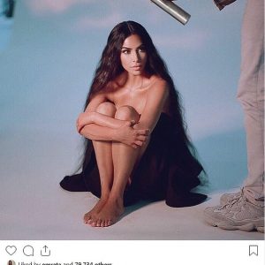 Kim Kardashian smolders as she shares new behind the scenes image from perfume shoot
