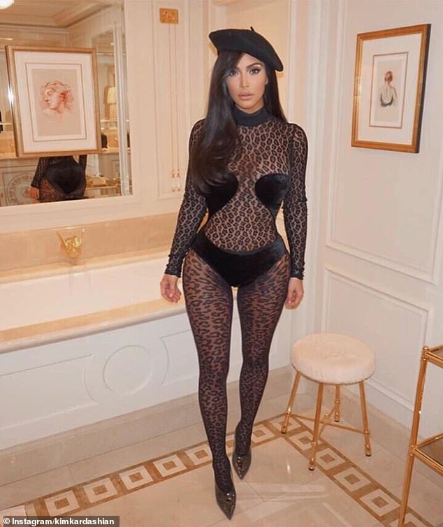 Wow: Kim Kardashian left nothing to the imagination as she slipped into a racy semi-sheer bodysuit for an evening stroll in Paris on Wednesday