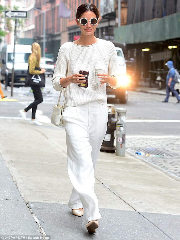 White H๏τ! Lily Aldridge appeared sophisticated in a white business chic ensemble as she headed to the offices of Vogue in New York City on Monday