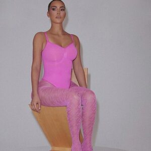 Bubblegum pink: Kim Kardashian, 41, looked incredible in a bubblegum pink SKIMS bodysuit and matching Fendi tights