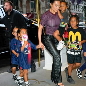 Family outing: Kim Kardashian (center) was spotted out early Monday morning in NYC with her niece, Dream Kardashian (far left), and her three younger children: daughter Chicago (on the left slightly in front of Dream), son Pslam (the child that Kardashian is carrying), and son Saint (far right)