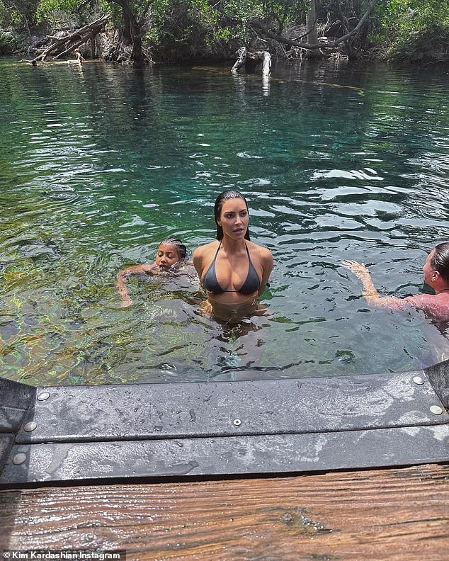 Mom and Son: One of the pictures showed Kardashian looking away from the camera with her seven-year-old-son Saint, swimming behind her