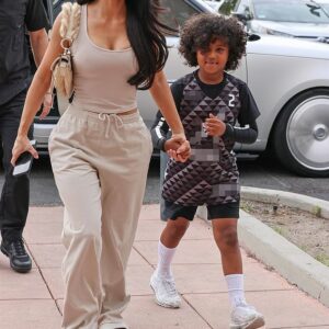 The latest: Kim Kardashian showcased her slim figure in a cream colored tank top with matching sweats