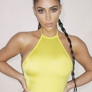 Golden goddess: Kim Kardashian, 39, put her elegantly made-up face and gentle pout on display Tuesday in a follow-up photo in a pale yellow one-piece swimsuit that she debuted the day before