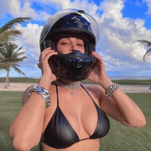Paradise: Kim appeared to be in the same tropical location from where she posted photos of herself wearing a motorcycle helmet with a black leather bra and just a white towel wrapped around her bottom half
