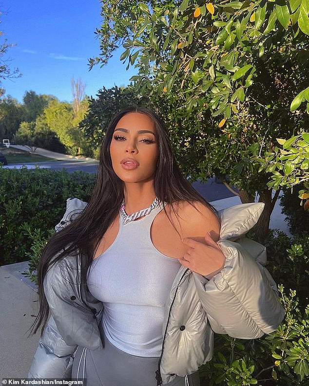 Glam: Kim Kardashian showed off a glitzy new personalized piece of jewelry in a carousel of pH๏τos that she shared with her 295 million Instagram followers