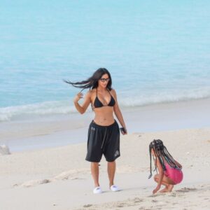 Kim Kardashian showed off her bikini fugure as daughter Chicago made a sandcastle on the beach